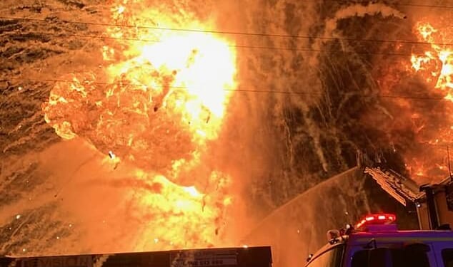 Projectiles burst out of the blaze like a firework display