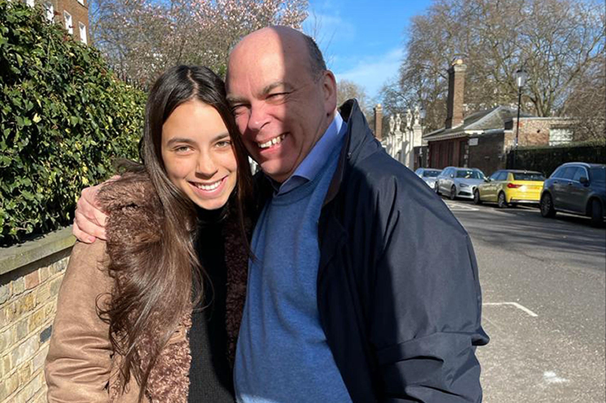 Hannah and Mike Lynch smiling for a picture outdoors.