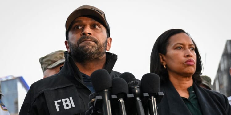 FBI Director Kash Patel speaks as D.C. Mayor Muriel Bowser looks on during a news conference after a shooting in downtown Washington, D.C., on Nov. 26, 2025.