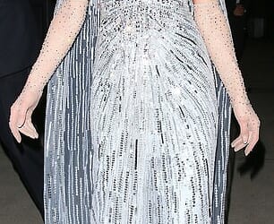 Fans are convinced Paris Hilton has made a secret dig against Meghan Markle after she turned up at the same party as her wearing a $4600 Jenny Packham dress worn by Kate Middleton