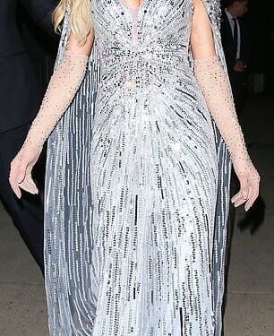 Fans are convinced Paris Hilton has made a secret dig against Meghan Markle after she turned up at the same party as her wearing a $4600 Jenny Packham dress worn by Kate Middleton