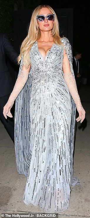 Fans are convinced Paris Hilton has made a secret dig against Meghan Markle after she turned up at the same party as her wearing a $4600 Jenny Packham dress worn by Kate Middleton