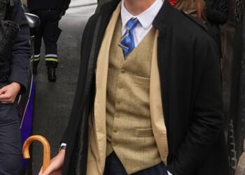 With a brown fedora tipped over one eye and a Yves Saint Laurent waistcoat, Pedro Elias Garzon Delvaux strutted past three police officers leaning against a silver car