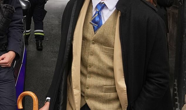 With a brown fedora tipped over one eye and a Yves Saint Laurent waistcoat, Pedro Elias Garzon Delvaux strutted past three police officers leaning against a silver car