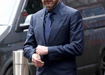 Film producer Kevin Proctor, pictured outside Manchester magistrates' court on Thursday, hired private investigators to track a Hollyoaks actress after she ended their 'toxic' relationship