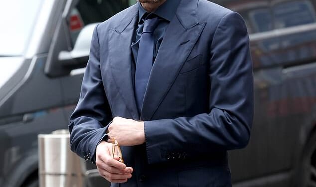 Film producer Kevin Proctor, pictured outside Manchester magistrates' court on Thursday, hired private investigators to track a Hollyoaks actress after she ended their 'toxic' relationship