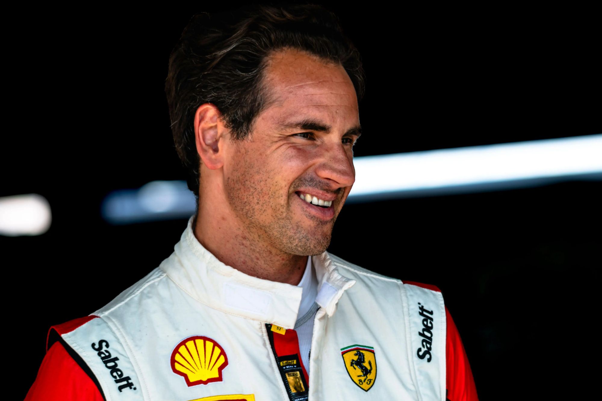 An image collage containing 1 images, Image 1 shows Adrian Sutil, former Formula 1 driver, smiling at the Ferrari Challenge 2022 at Hockenheim