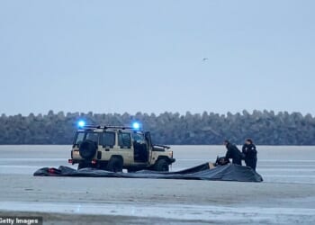 French police are preparing to use 30-metre nets to snare migrant boats in the Channel - despite warning the tactic is so dangerous it could leave people dead. Pictured: French police vessel passes lifejackets to migrants on a dinghy as they cross the English Channel on August 25, 2025