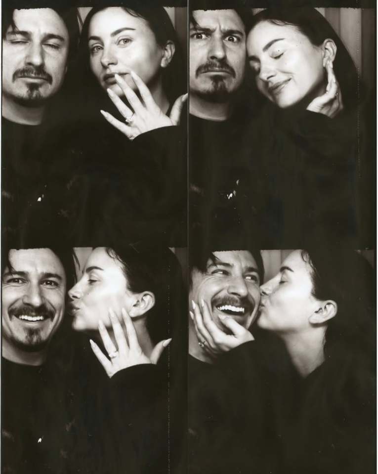Collage of four black and white photo booth pictures of a man and woman making playful and affectionate poses.