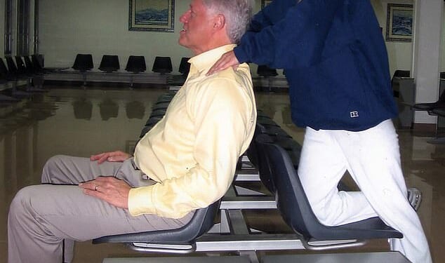 Bill Clinton receives a massage from Jeffrey Epstein victim Chauntae Davies in 2002. The former president has previously denied knowing anything about the financier's crimes