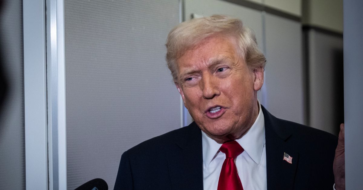 President Donald Trump speaks to reporters aboard Air Force One on its way to Florida on Nov. 25, 2025.