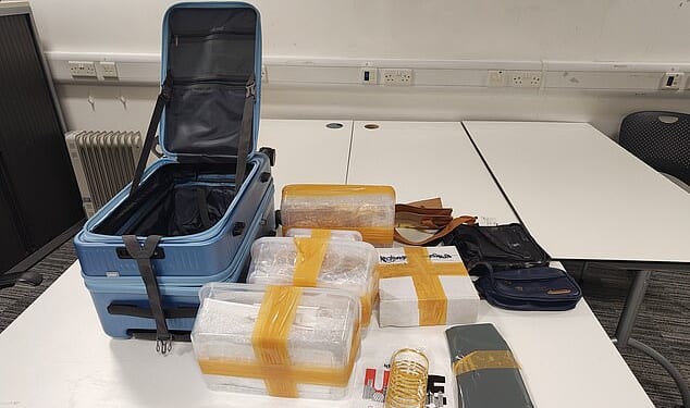 Money and gold worth up to £2million were seized at Manchester Airport in a 'record' haul
