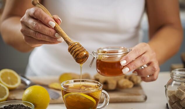 A hot sweet drink, such as a cup of honey with lemon, is a simple way of relieving the symptoms of a cough and sore throat