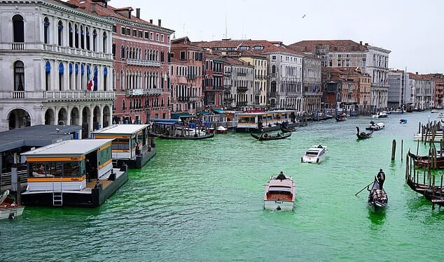 Venice's Grand Canal after being dyed green by Extinction Rebellion. It was one of 10 Italian cities targeted