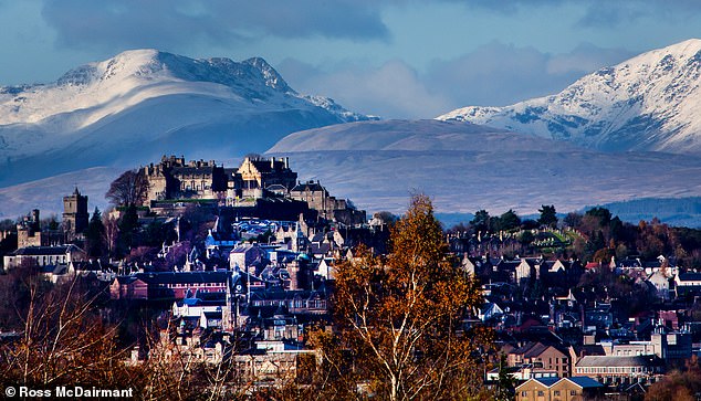STERLING, NOVEMBER 14: Snowfall on top of the hills behind Stirling Castle as an icy Arctic blast moves in