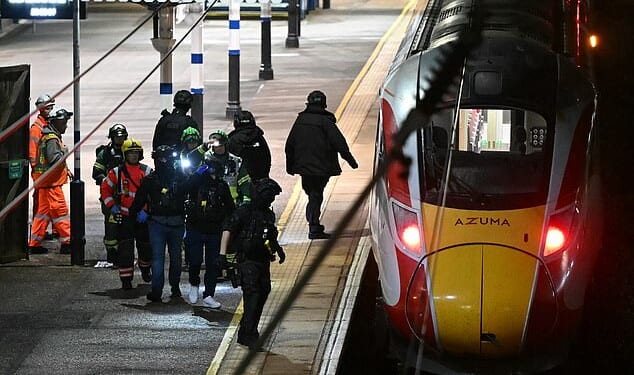 Police on the platform at Huntingdon Station in Cambridgeshire on Saturday night following the attack