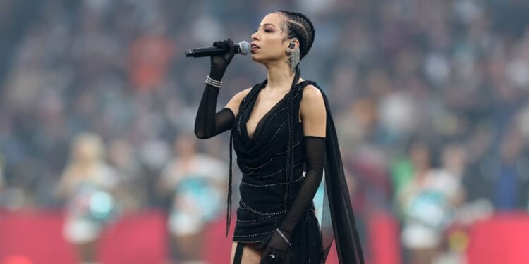 Karina Pasian sings the national anthem prior to the NFL 2025 game between Washington Commanders and Miami Dolphins at Estadio Santiago Bernabeu on Nov. 16, 2025, in Madrid, Spain.