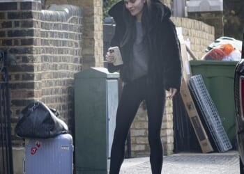 Holly Ramsay clutched a 'Bride' phone case as she broke cover on Thursday morning for the first time since her feud with fiancé Adam Peaty 's family came to light
