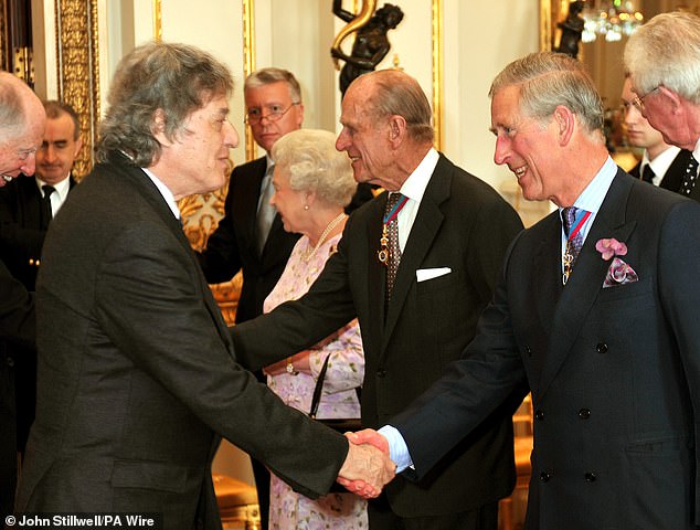 King Charles (right) shaking hands with Sir Thomas Stoppard (left) in 2009 before a lunch for members of the Order of Merit at Buckingham Palace in London
