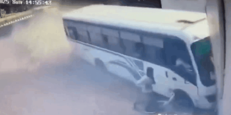 Horror moment out-of-control bus misses parked cyclist by just inches as it crashes into building