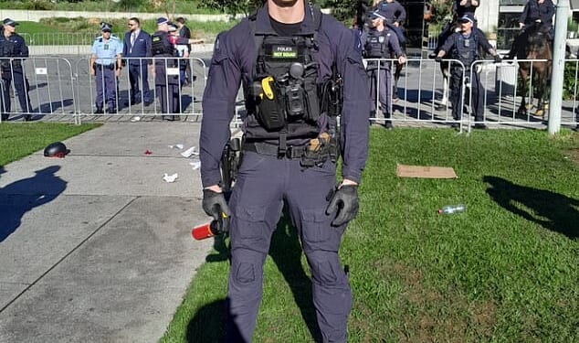 Australians admired a NSW Police officer from the riot squad after a fiery protest in Sydney