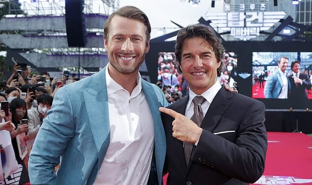 Glen Powell was being hailed as Hollywood¿s next Tom Cruise - but his latest action thriller Running Man has hit a brutal box office snag; (Powell and cruise in 2022)