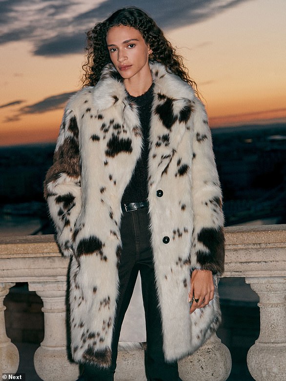 Stand out from the crowd with this striking £85 Cream Cow Print Faux Fur Coat from Next