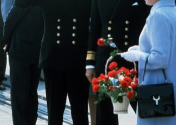 Queen Elizabeth has left King Charles paying the price for the many scandals of her beloved son Andrew. Pictured: Queen Elizabeth ll, gives her son Andrew a rose which he promptly puts in his mouth after they have disembarked from HMS Invincible upon his return from the Falklands war on September 17, 1982 in Portsmouth, England