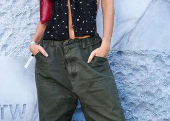 Model Emily Ratajkowski is pictured wearing oversized khaki cargo trousers in Paris in 2024 for a Vans event