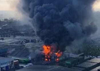 Images show the building engulfed in flames as a giant plume of black smoke billows into the sky