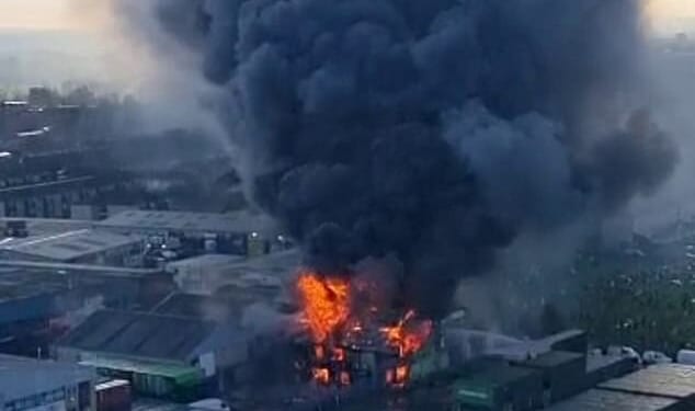 Images show the building engulfed in flames as a giant plume of black smoke billows into the sky