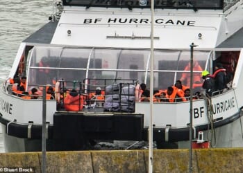 UK Border Force 'Hurricane' brings migrants ashore at Dover earlier today after they were picked up in the middle of the Channel