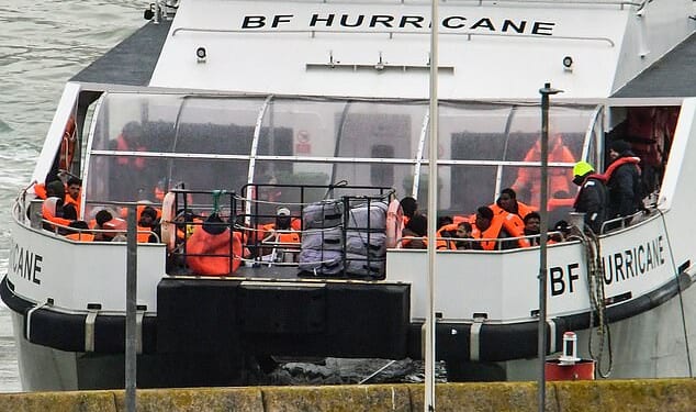 UK Border Force 'Hurricane' brings migrants ashore at Dover earlier today after they were picked up in the middle of the Channel