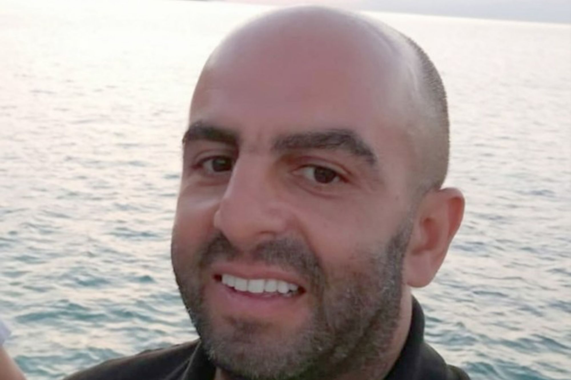 An image collage containing 1 images, Image 1 shows Samir Zitouni, London North Eastern Railway staff member, smiling in front of the sea