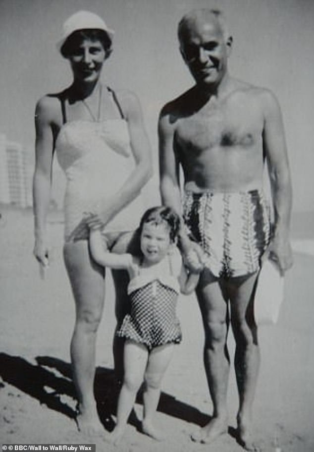 Her father, Edward Wachs and mother, accountant Berthe Goldmann, were Austrian Jews and fled Vienna in 1938 to escape Nazi threat (Ruby pictured with her parents in the 1950s)