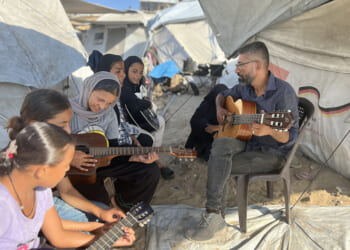 In Gaza, a music teacher sings above the din of war
