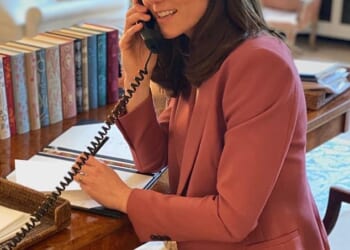 The Princess of Wales is pictured in 2020 in her stylishly decorated office in Kensington Palace  - complete with piles of classic books in the background