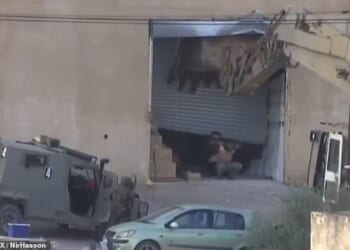 Israeli troops have been accused of executing two unarmed Palestinian men who surrendered during a raid in the West Bank.