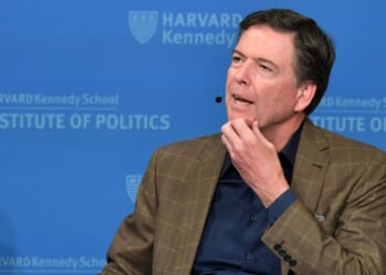 Former FBI Director James Comey speaks at Harvard Kennedy School with Harvard's Eric Rosenbach on Feb. 24, 2020, in Boston, Massachusetts.