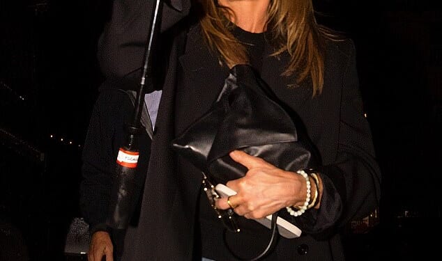 Jennifer Aniston was glimpsed indulging in a date night Friday with her boyfriend, Hollywood hypnotist and 'love guru' Jim Curtis