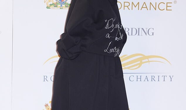 Jessie J didn't let the blustery weather dampen her spirits as she beamed while her dark locks were blown around on the red carpet at the Royal Variety Performance on Wednesday night.