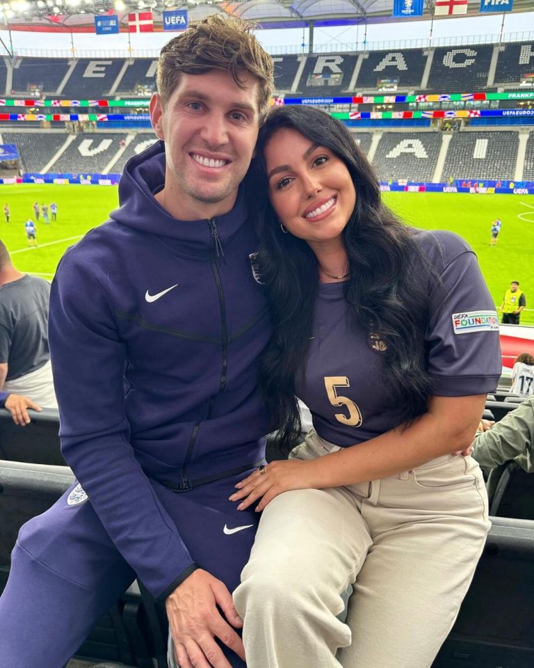 John Stones and Olivia Naylor at a UEFA football match.