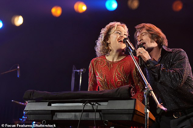 The biographical musical drama follows down-on-his-luck Milwaukee musician, Mike Sardina, played by Hugh, who teams up with another struggling muso, Claire - played by Kate - to form a Neil Diamond tribute double-act they dub Lightning & Thunder (seen in film)