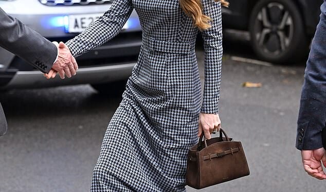 The Princess of Wales wowed in a monochrome dress today as she visited children's mental health charity Anna Freud