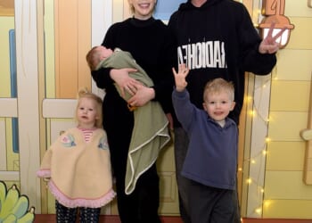 Katherine Ryan cradled her baby girl, Holland, as she and her family attended a Bluey's Aussie Christmas event at Bluewater Shopping Centre in Greenhithe on Saturday