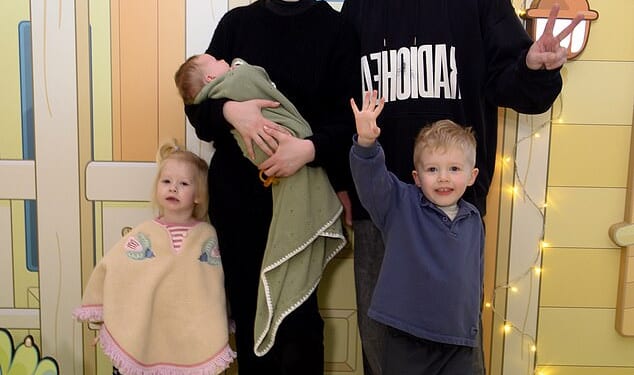 Katherine Ryan cradled her baby girl, Holland, as she and her family attended a Bluey's Aussie Christmas event at Bluewater Shopping Centre in Greenhithe on Saturday