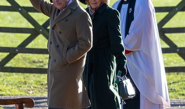 King Charles wrapped up warm, placing his hands inside his brown double-breasted overcoat, which he paired with grey suit trousers and taupe coloured loafers