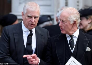 FILE PHOTO: Britain's Prince Andrew speaks with King Charles as they leave Westminster Cathedral at the end of the Requiem Mass, on the day of the funeral of Britain's Katharine, Duchess of Kent, in London, Britain, September 16, 2025