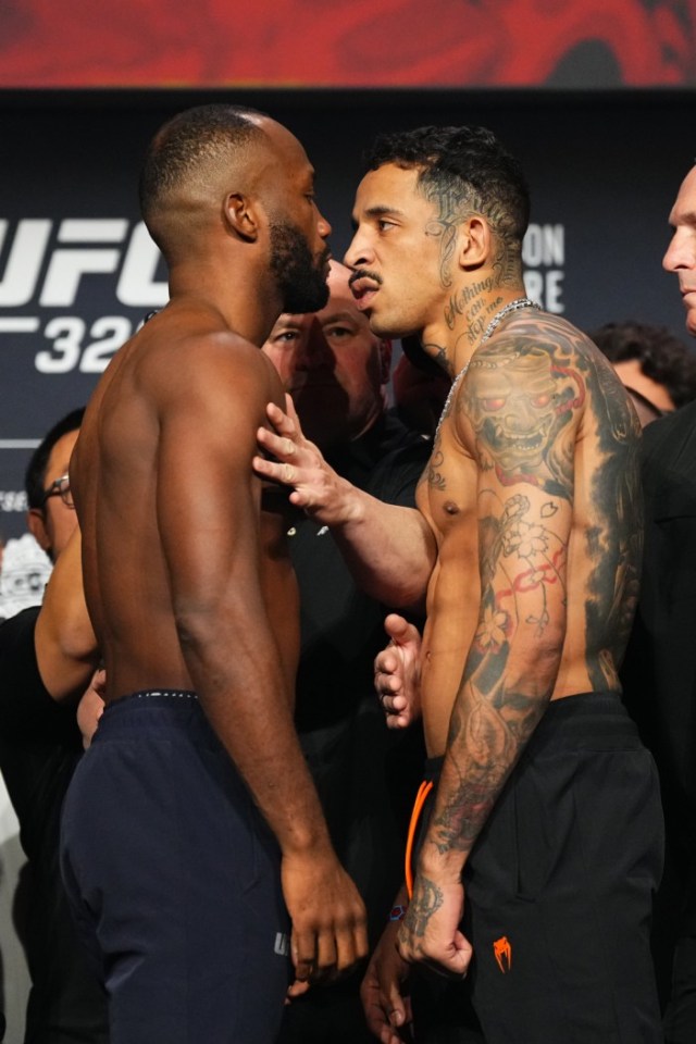 Two male UFC fighters, Della Maddalena and Makhachev, face off shirtless at a ceremonial weigh-in.
