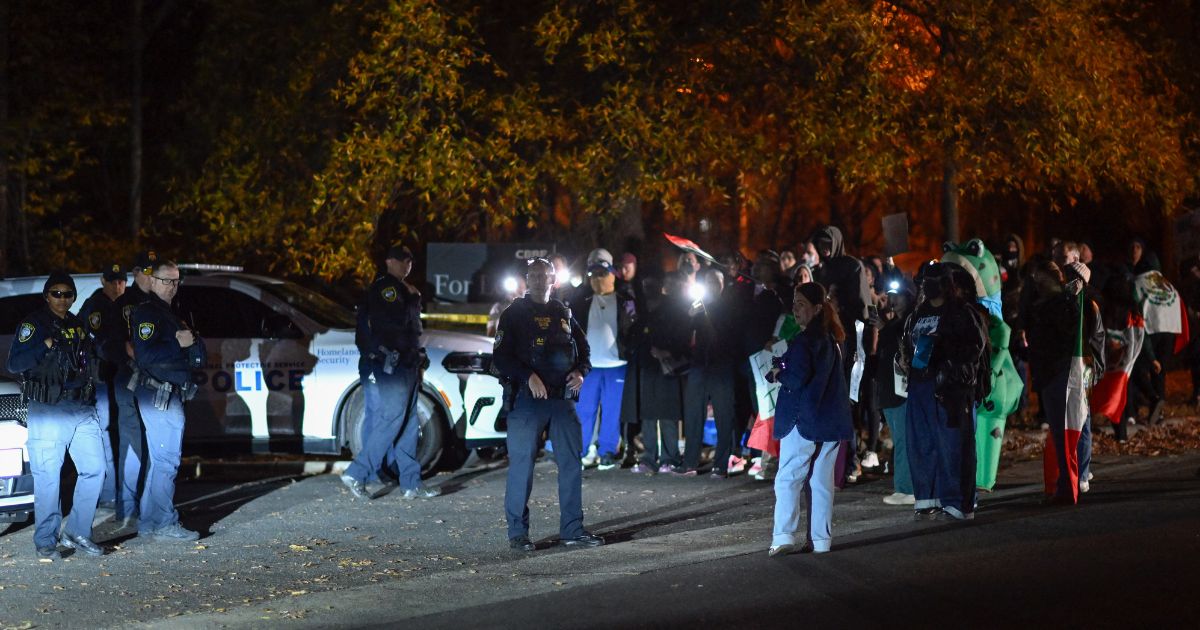 Protesters demonstrate against raids conducted by Immigration and Customs Enforcement outside the Department of Homeland Security office in Charlotte, North Carolina, on Nov. 16, 2025.